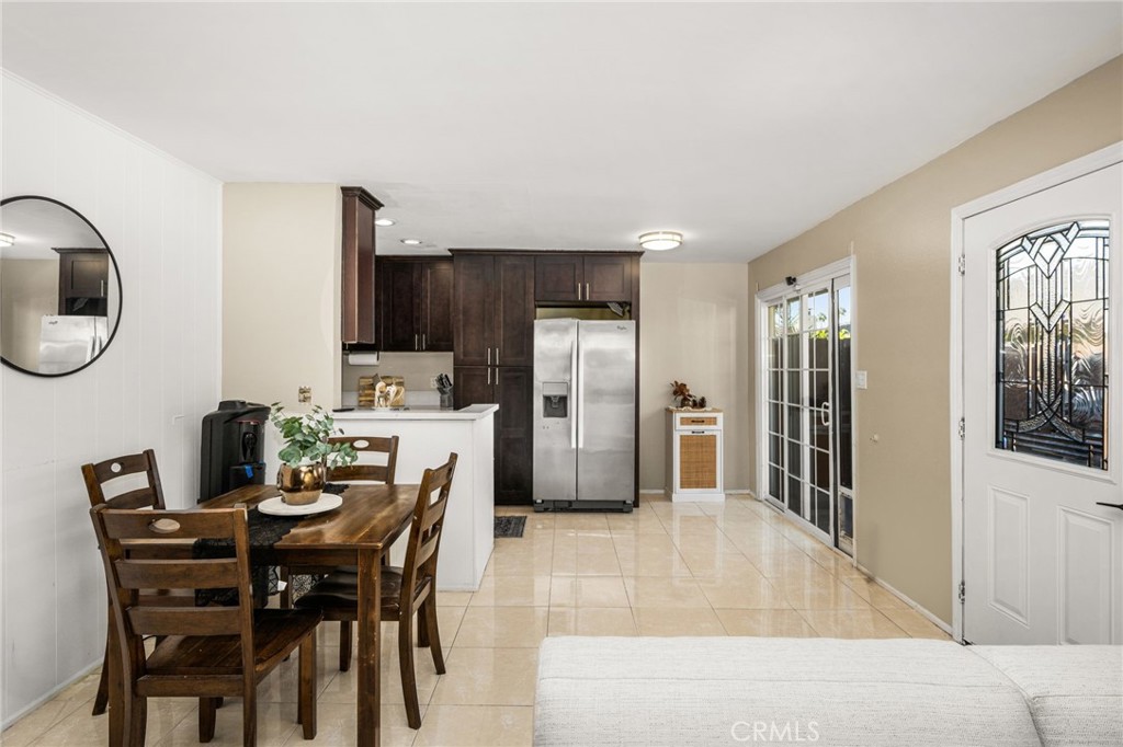 Dining area with access to patio through the sliding door - 134 S Magnolia Avenue 2C, Anaheim CA 92804 - photo 9