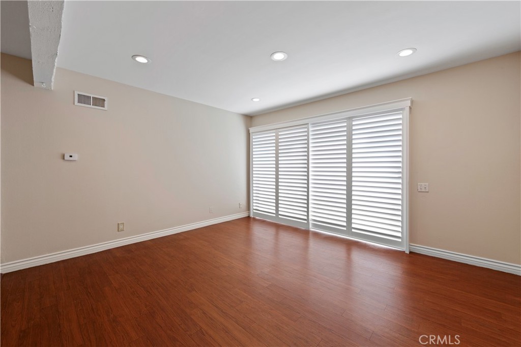 living room with slider to patio - 1381 S Walnut Street 2008, Anaheim CA 92802 - photo 1