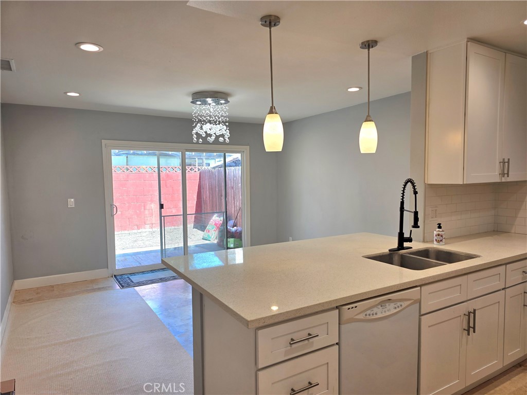Beautiful remodel. Recesses lights, crystal chandelier, pendant lighting over quartz breakfast bar. - 1541 E La Palma H2, Anaheim CA 92805 - photo 1
