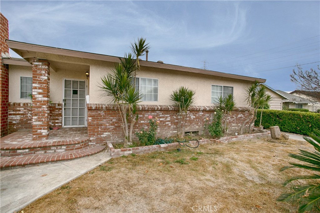 Sprawling Single Story 6 Bedroom, 3 Bath Home with 2,206 Sq Ft on Interior Cul-de-Sac Street w/Brick Porch, Siding, & Ra - 1608 S Ivanhoe Street, Anaheim CA 92804 - photo 1
