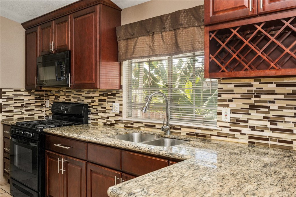 Kitchen w/ wine rack - 1616 S Euclid 71, Anaheim CA 92802 - photo 14