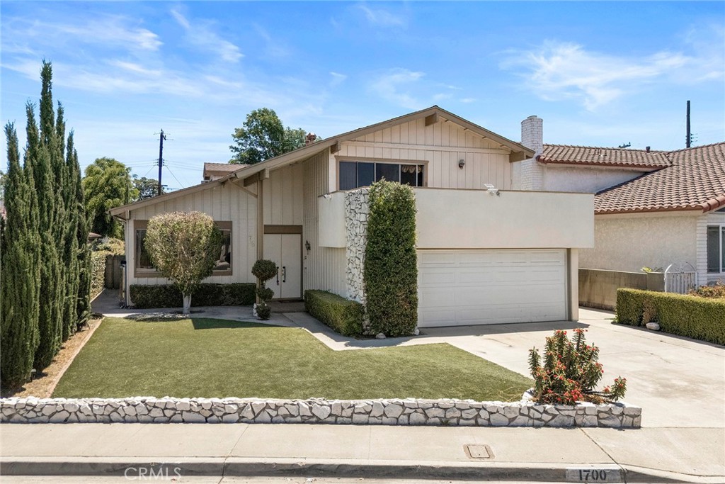 Tri Level POOL Home in desirable "The Groves" neighborhood - 1700 S Carnelian Street, Anaheim CA 92802 - photo 1