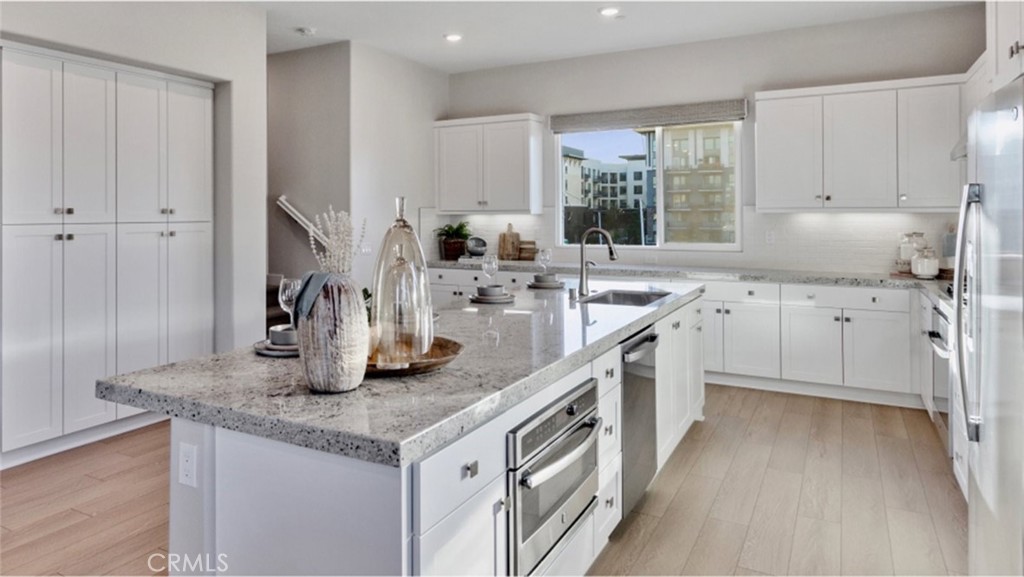 Photos shown are of model only- not actual homesite. - 1848 S Westside Drive 7, Anaheim CA 92805 - photo 1