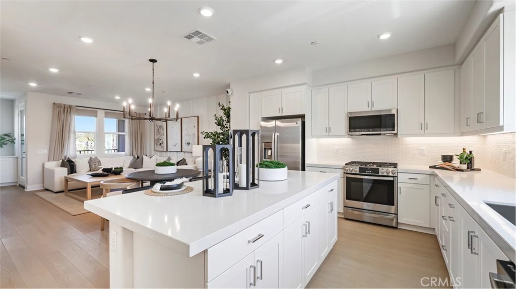 Photos shown are of model only- not actual homesite. - 1860 S Union Street 8, Anaheim CA 92805 - photo 1