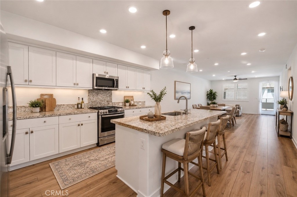 Kitchen, virtually staged - 1863 S Union 56, Anaheim CA 92805 - photo 1