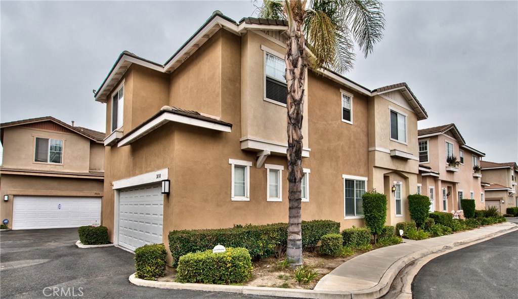 Home at last! Located in the desirable gated community of Peppertree Walk and near shopping, dining and transportation, - 2030 W Blue Violet Court, Anaheim CA 92801 - photo 1