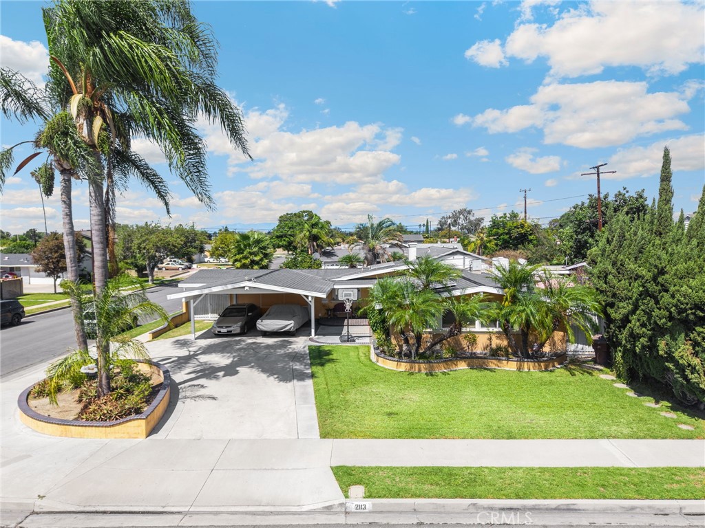 Front of home with carport for 2 vehicles - 2113 W Niobe, Anaheim CA 92804 - photo 1