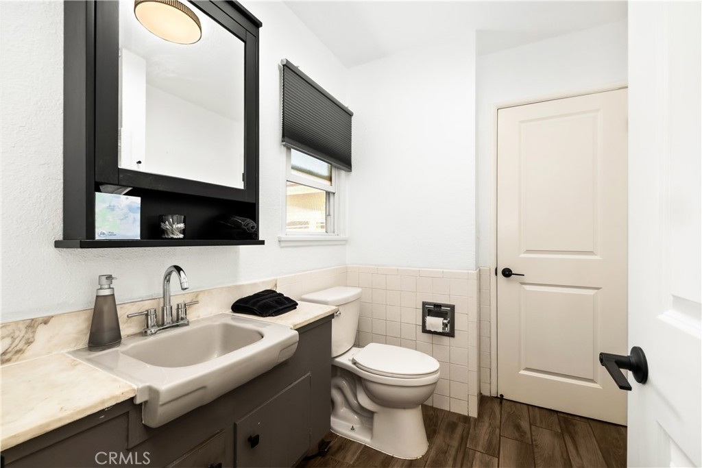 2nd Bathroom with access to 3rd bedroom and hallway - 2211 E Romneya Drive, Anaheim CA 92806 - photo 37