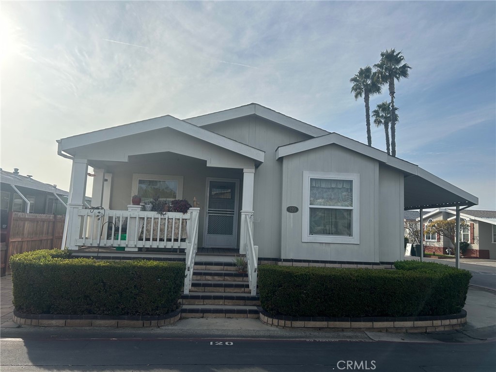 beautifully landscaped frontage features a raised porch area - 2300 Lewis Stree Street, Anaheim CA 92802 - photo 2