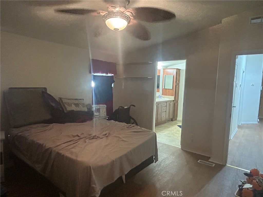 Huge master suite. The bed, like many quality furniture pieces will remain should the buyers' agent ask in their offer - 2300 Lewis Stree Street, Anaheim CA 92802 - photo 9