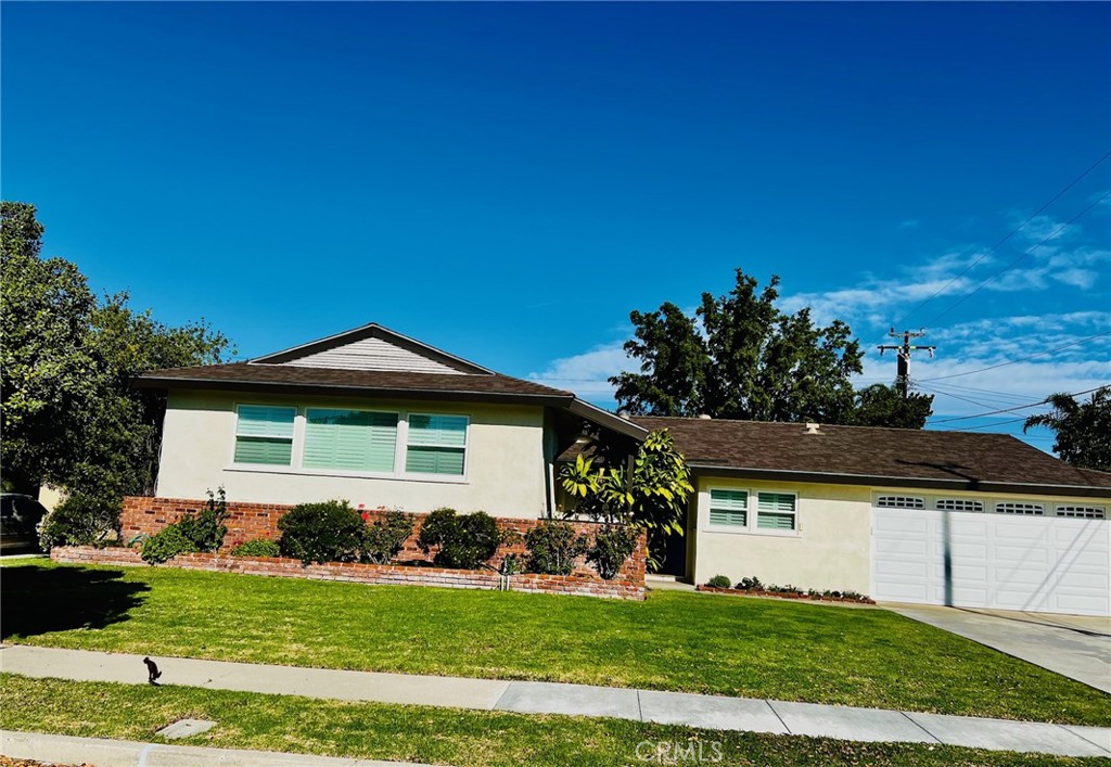 Front of home on nice residential street. - 2421 E Normandy, Anaheim CA 92806 - photo 1