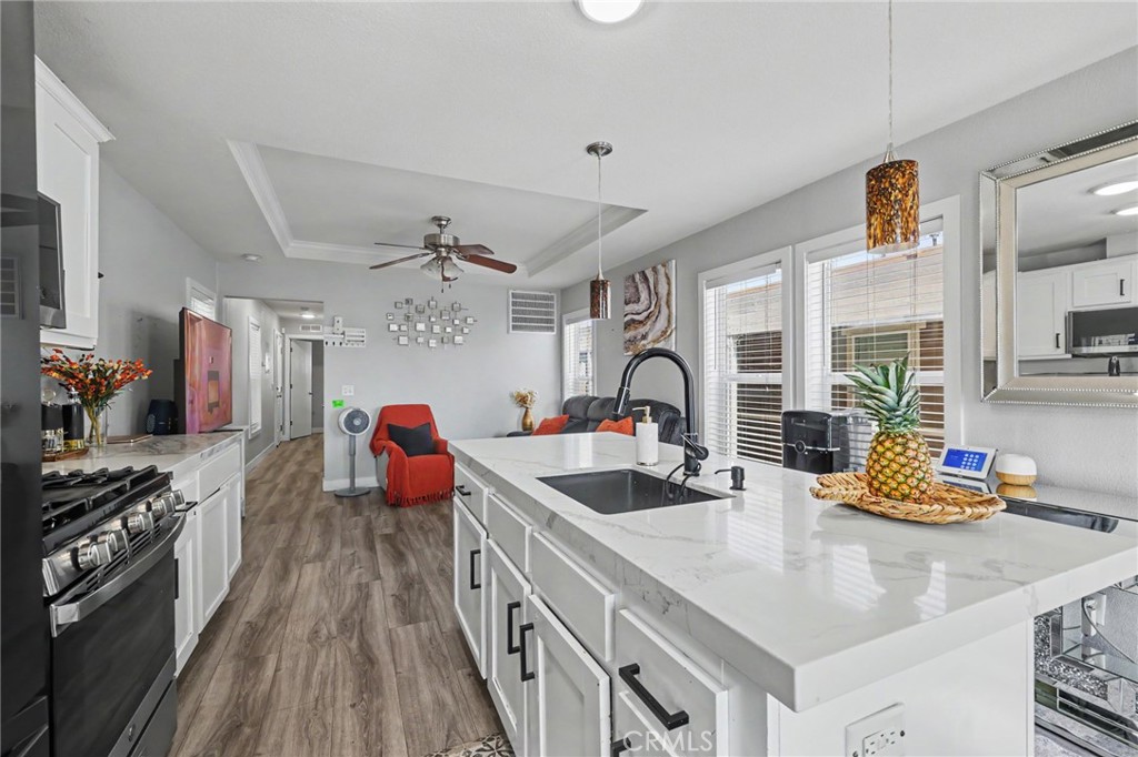 Kitchen island equipped with built-in storage cabinets - 250 W Midway Drive 2, Anaheim CA 92805 - photo 9