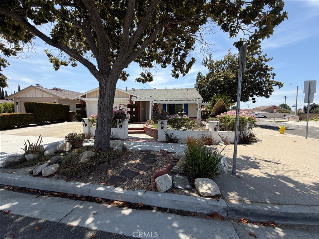 Single story home with mature shade tree, low-maintenance front landscaping. - 2512 W Fulcrum, Anaheim CA 92804 - photo 1