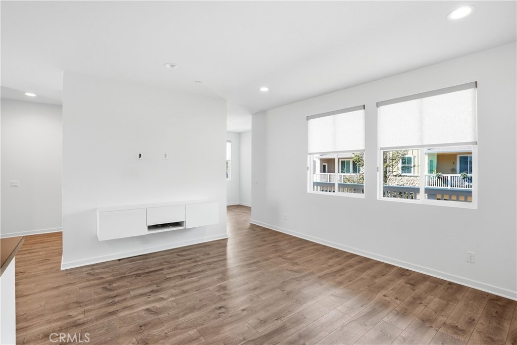 Living Room Area Looking towards the Balcony - 310 N Bellarose Way, Anaheim CA 92805 - photo 5