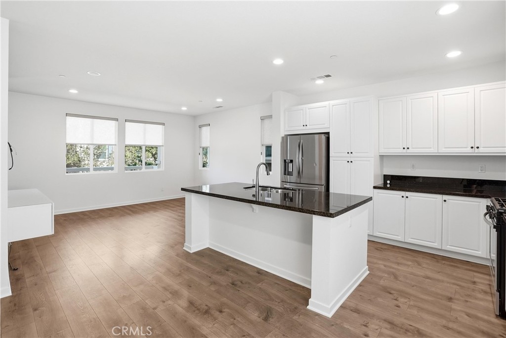 Open Kitchen to Great Room - 310 N Bellarose Way, Anaheim CA 92805 - photo 6