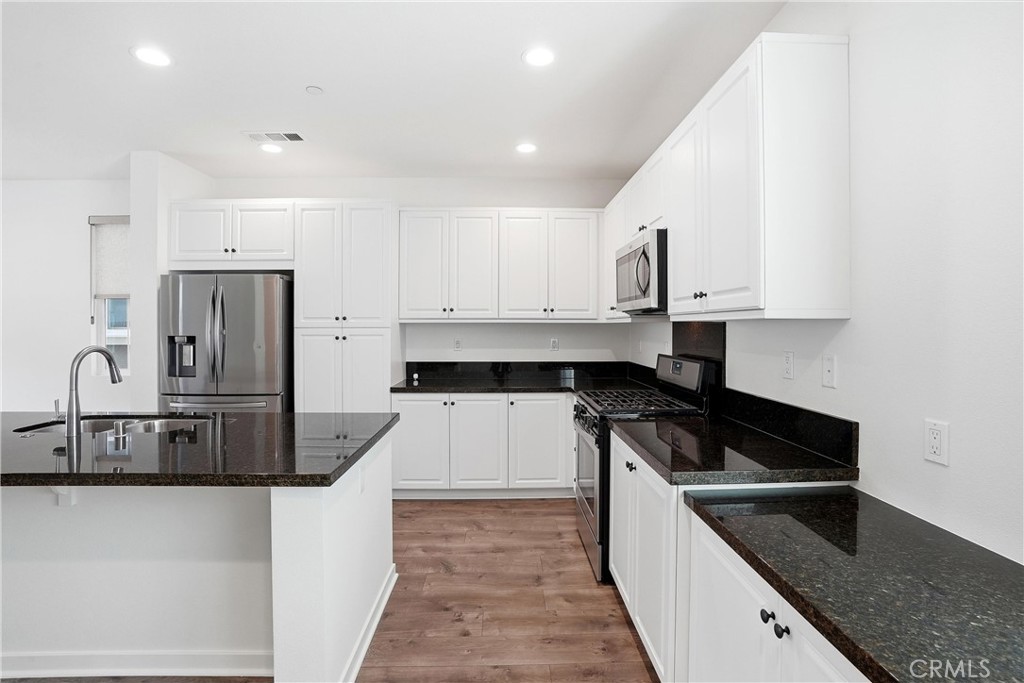 From Dining area looking towards kitchen - 310 N Bellarose Way, Anaheim CA 92805 - photo 10