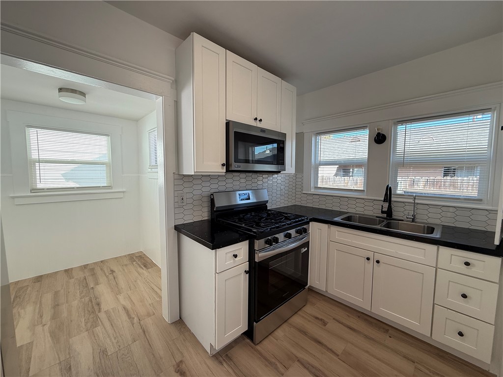 Brand new stove. Microwave hood vent. - 323 S Kroeger Street, Anaheim CA 92805 - photo 9