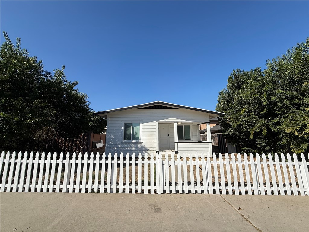 White picket fence with a gate - 323 S Kroeger Street, Anaheim CA 92805 - photo 19