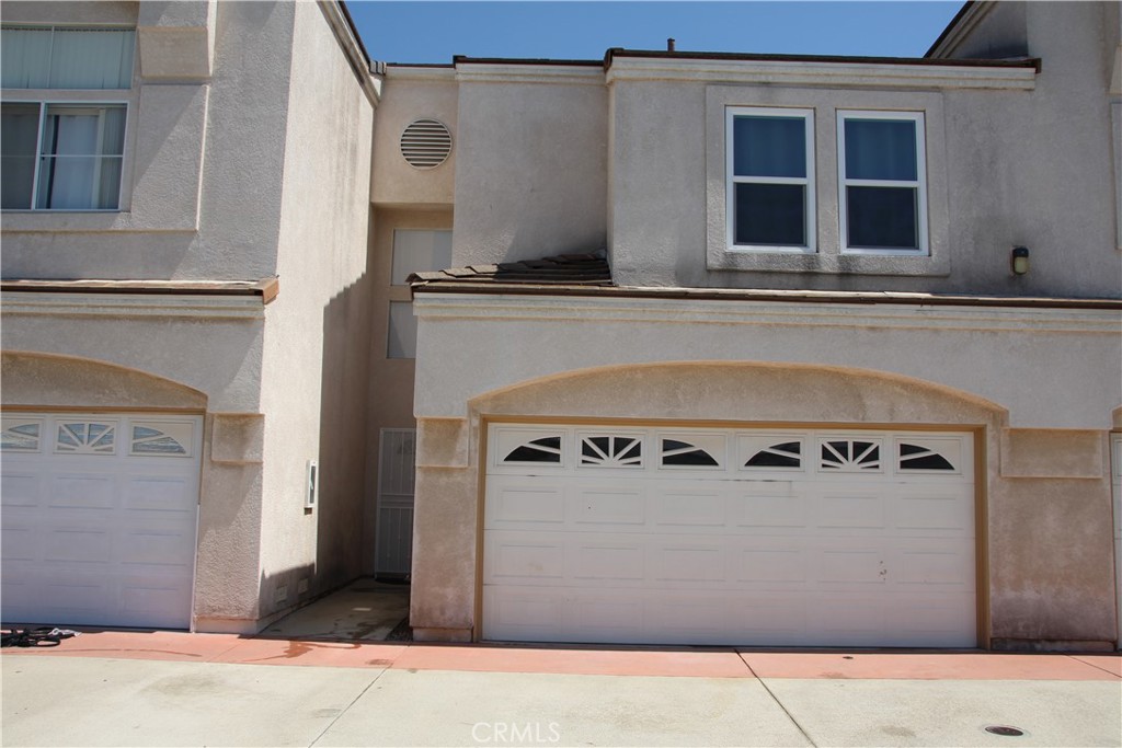 Front of condo 2 car garage - 3326 W Orange 106, Anaheim CA 92804 - photo 1