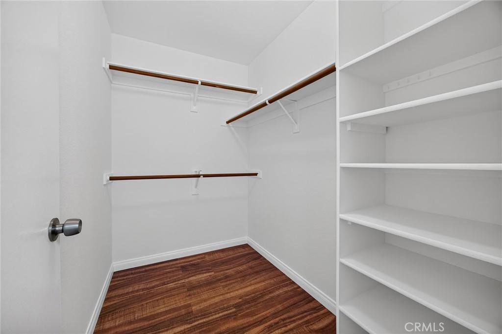Primary walk in closet - 3537 W Greentree Circle C, Anaheim CA 92804 - photo 22