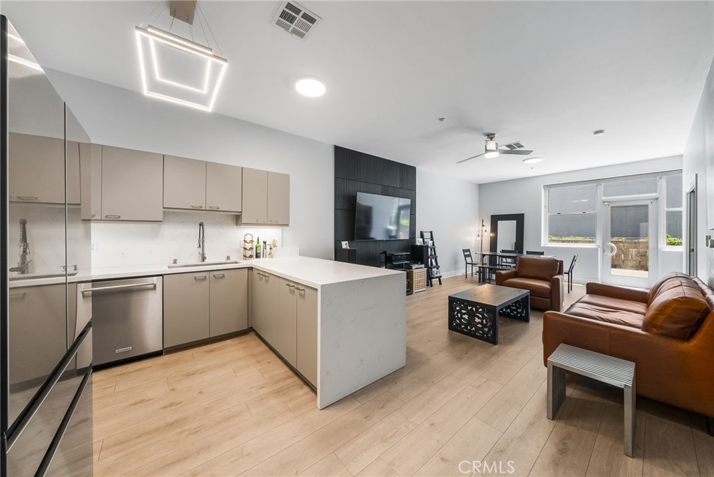 Updated kitchen with open floorplan that is great for entertaining - 435 W Center Street Promenade 221, Anaheim CA 92805 - photo 1