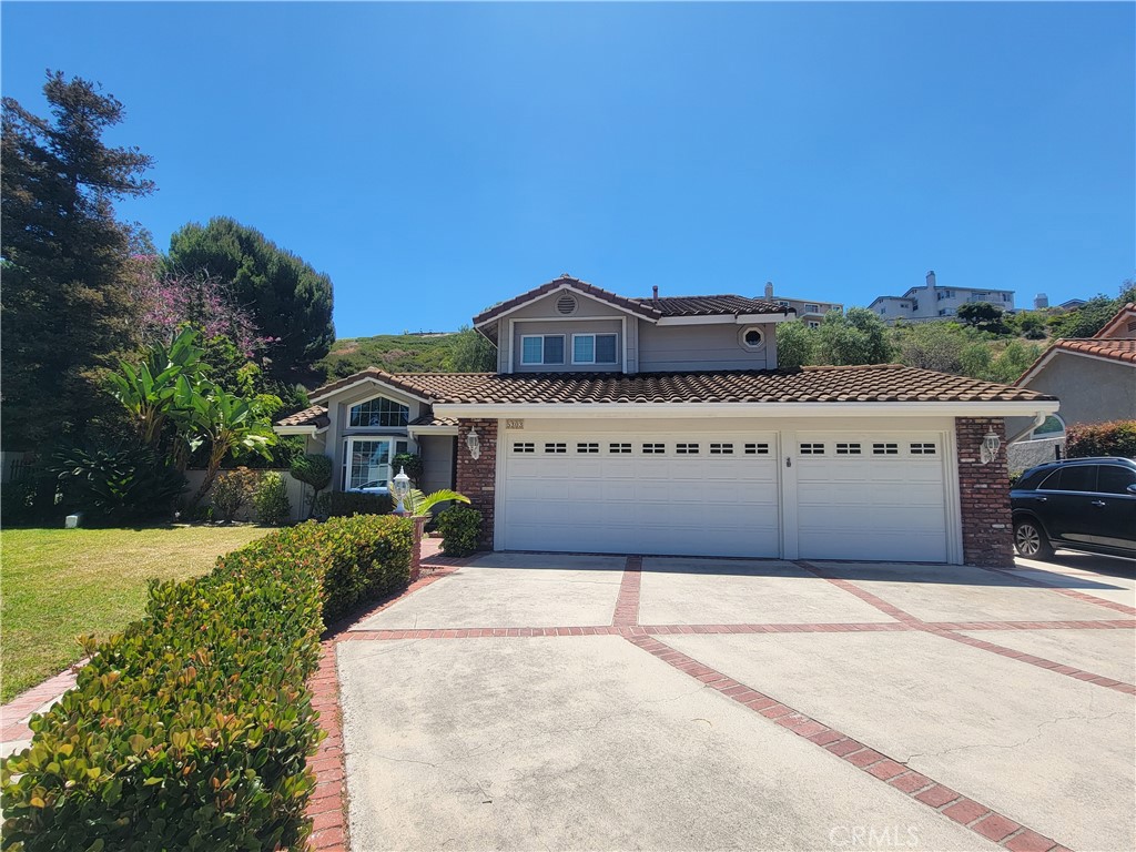 3 car garage with wide driveway - 5303 E Big Sky Lane, Anaheim CA 92807 - photo 1