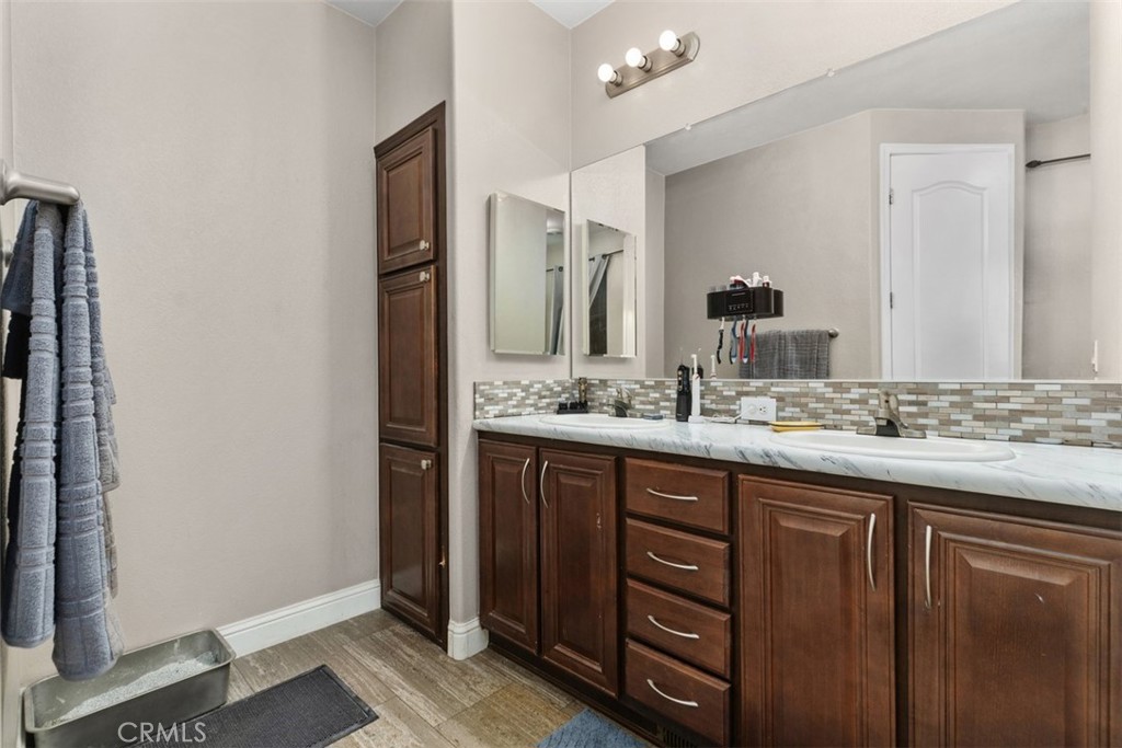 Primary bathroom w/dual corian sinks - 5815 La Palma Ave 304, Anaheim CA 92807 - photo 23