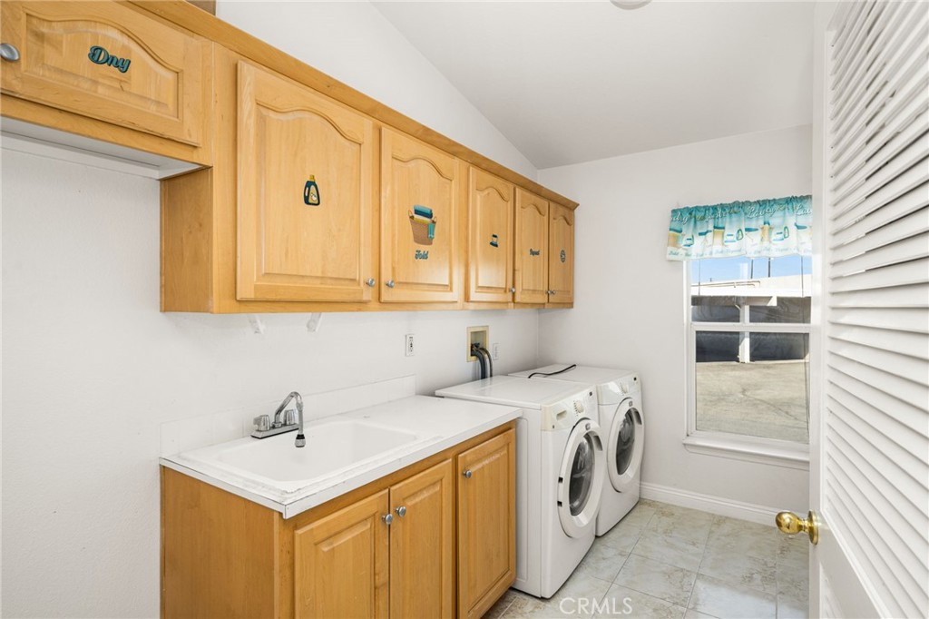 Inside Laundry Room w/ Sink & additional Storage Cabinets. - 70 Cherry, Anaheim CA 92801 - photo 30