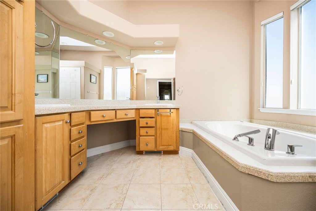 Dual Sinks with lots of Cabinetry, Separate Bathtub, and Private Toilet room. - 70 Cherry, Anaheim CA 92801 - photo 37