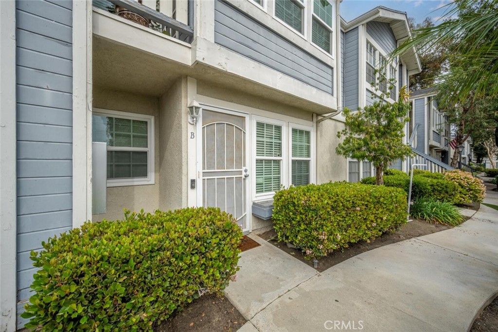 Lower Unit lined with nice landscaping. - 701 S Hayward Street B, Anaheim CA 92804 - photo 1