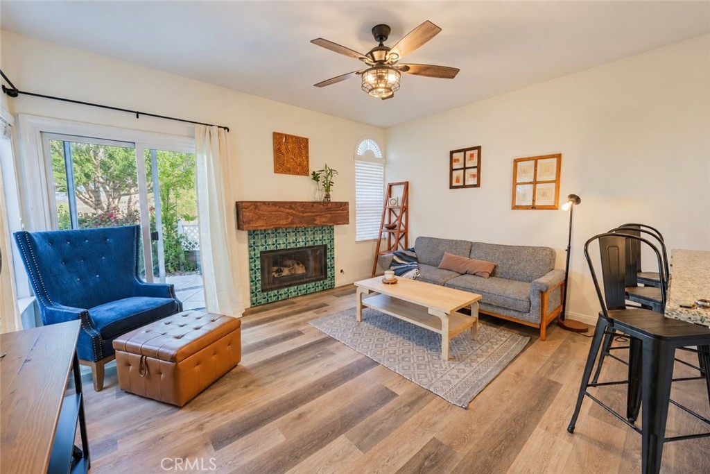 Family room with custom hand painted fireplace tile and beautiful view - 740 S Crown Pointe, Anaheim CA 92807 - photo 3