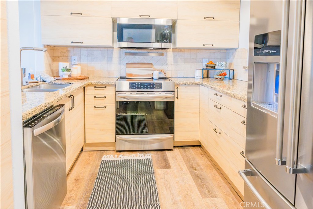 Stylish Kitchen Open to Family Room - 740 S Crown Pointe, Anaheim CA 92807 - photo 7