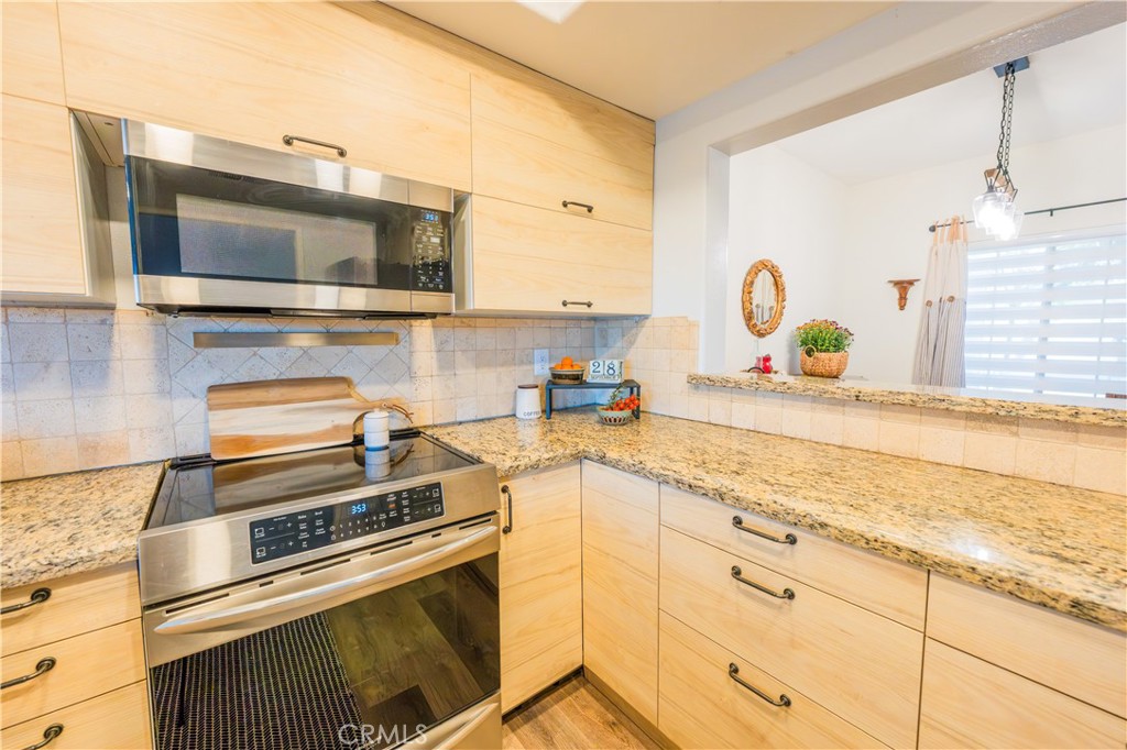 Stylish Kitchen Open to Family Room - 740 S Crown Pointe, Anaheim CA 92807 - photo 8
