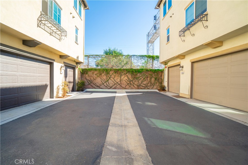 Shared driveway with attached garage​​‌​​​​‌​​‌‌​​‌‌​​‌‌​​‌​​​‌‌​‌​​​​‌‌​‌​​ access - 794 N Ethan Way, Anaheim CA 92805 - photo 3