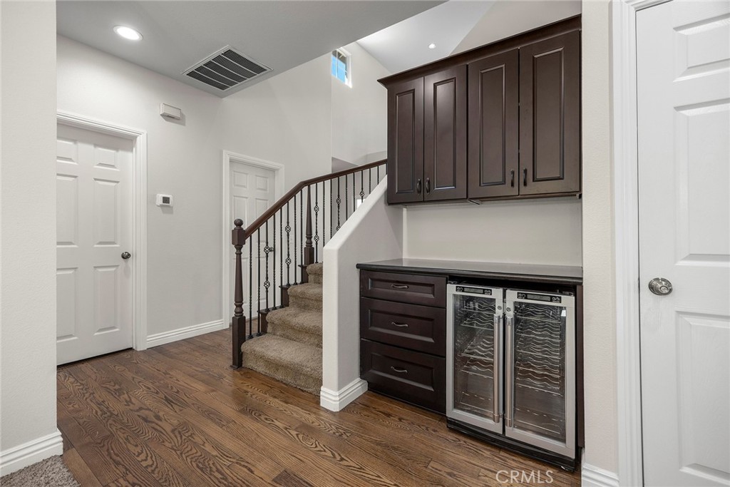 Large walk in storage & coat closet, with an dining room cabinet and wine refrigerator - 8751 E Running Springs Drive, Anaheim Hills CA 92808 - photo 15