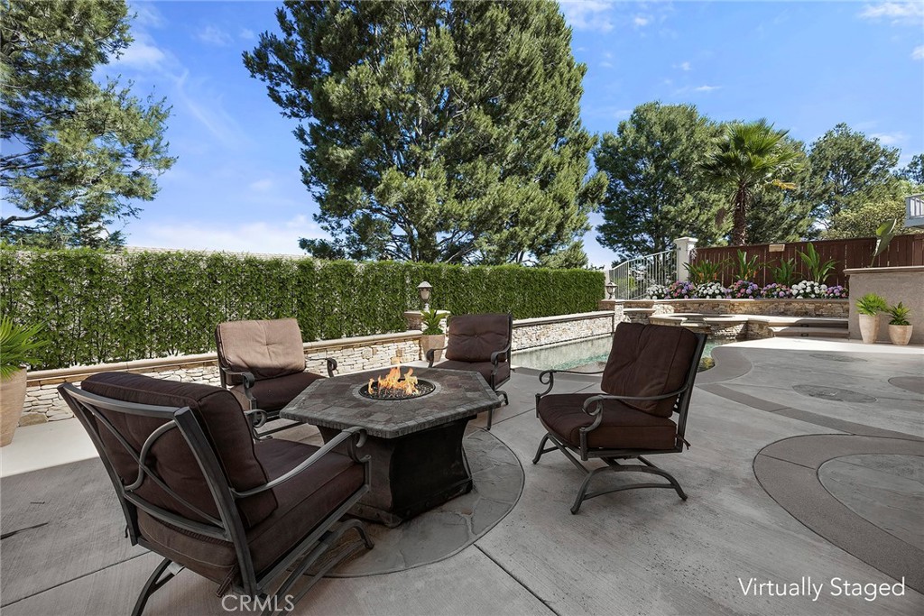 Planter and Pebble Tec pool have stacked stone design allowing for plenty of decorative landscape treatments. Pillars ha - 8751 E Running Springs Drive, Anaheim Hills CA 92808 - photo 27