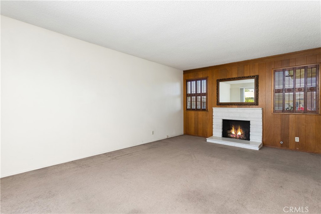Main home living room and fireplace - 8805 Stardust Lane, Anaheim CA 92804 - photo 15