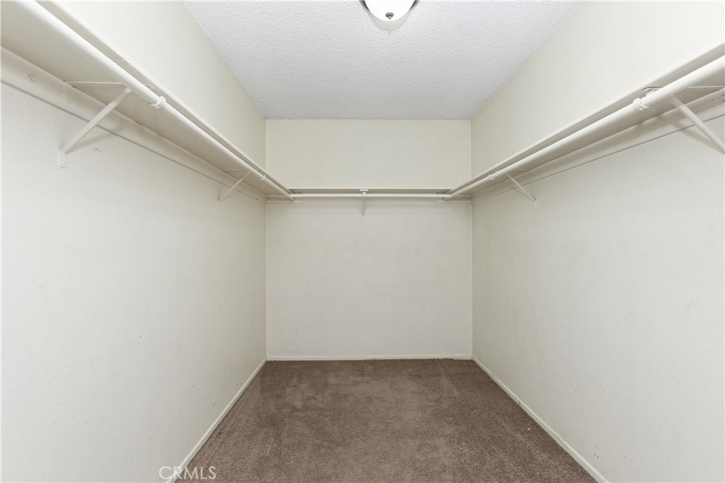 Large walk-in closet - 8805 Stardust Lane, Anaheim CA 92804 - photo 39