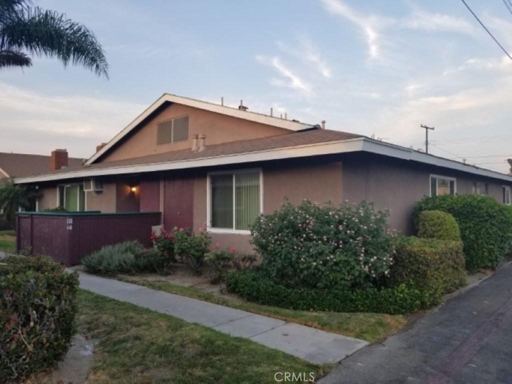 9166 Cerritos Ave., #64, Anaheim, CA 92804. View of Front Exterior #1, landscaping and newly installed double pane windo - 9166 Cerritos Avenue 64, Anaheim CA 92804 - photo 1