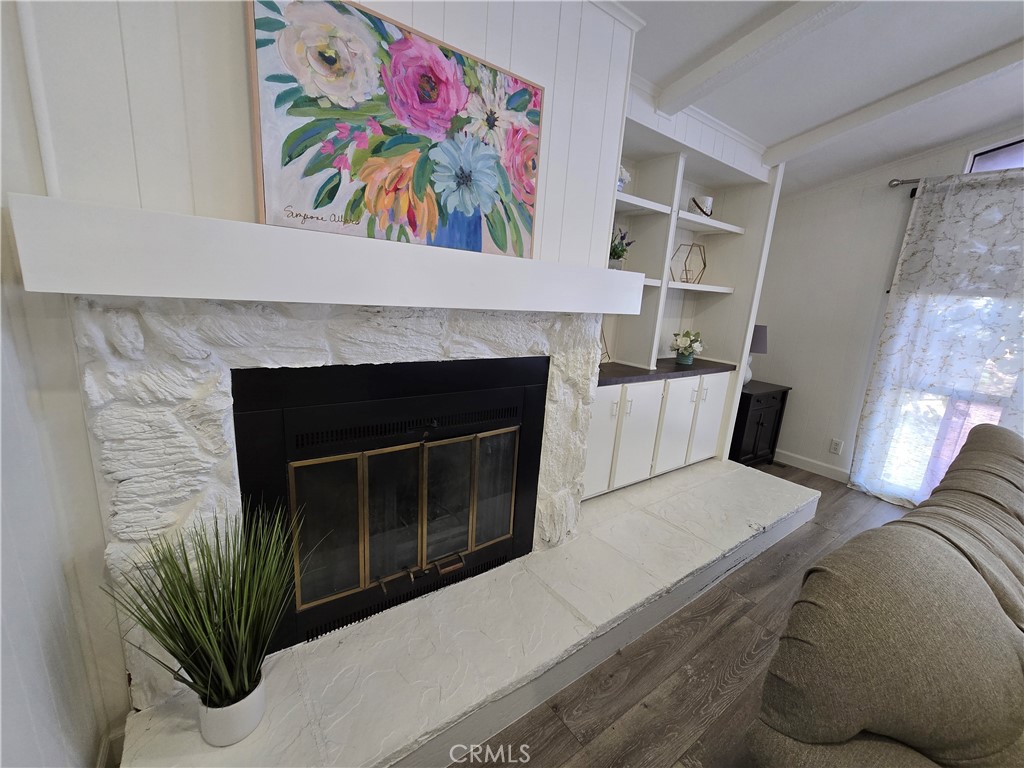 Fireplace and built in shelves in living room - 1051 Site Dr 112, Brea CA 92821 - photo 5