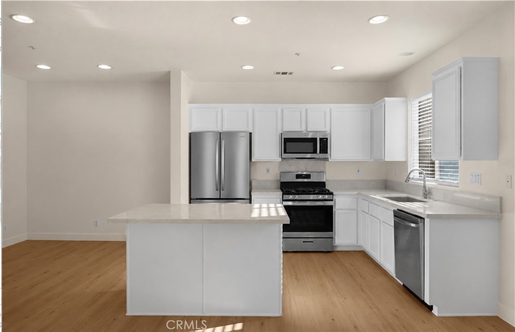Quartz counters and farm house sink. Virtually altered image - 123 S Orange Ave, Brea CA 92821 - photo 14