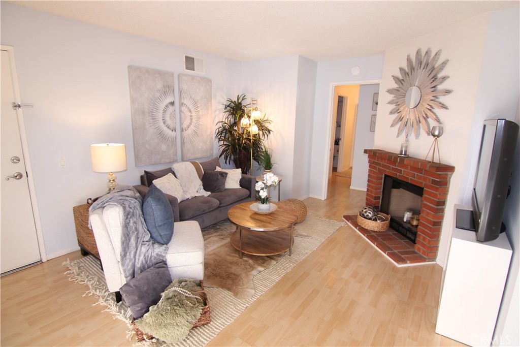 Living room w/ fireplace - 157 S Poplar Avenue 23, Brea CA 92821 - photo 1