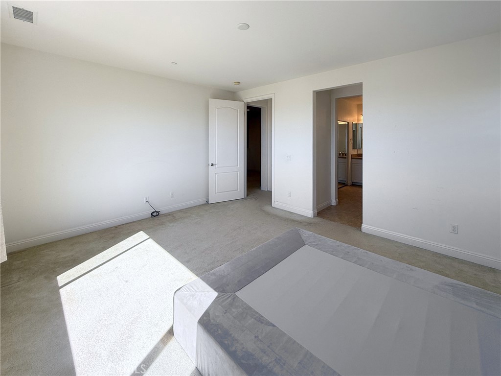Primary bedroom with en-suite bathroom access - 2700 E Coalinga Drive, Brea CA 92821 - photo 11