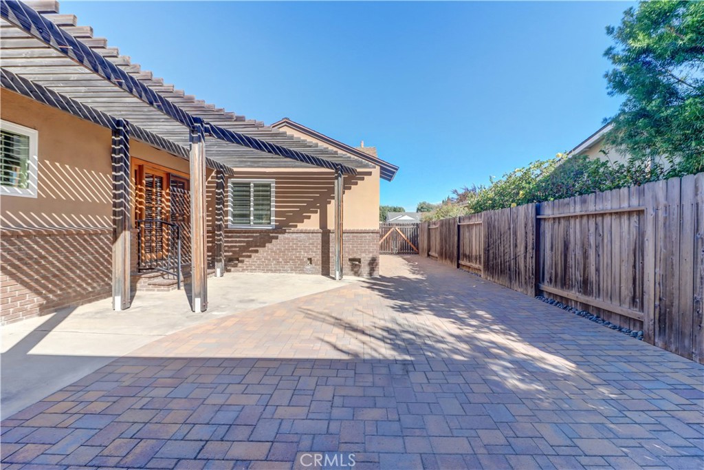 Covered patio looking towards the side gate/driveway entrance - 429 Catalpa Avenue, Brea CA 92821 - photo 24