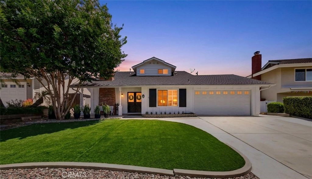 Photo enhanced to twilight for marketing purposes. - 841 Candlewood Street, Brea CA 92821 - photo 1
