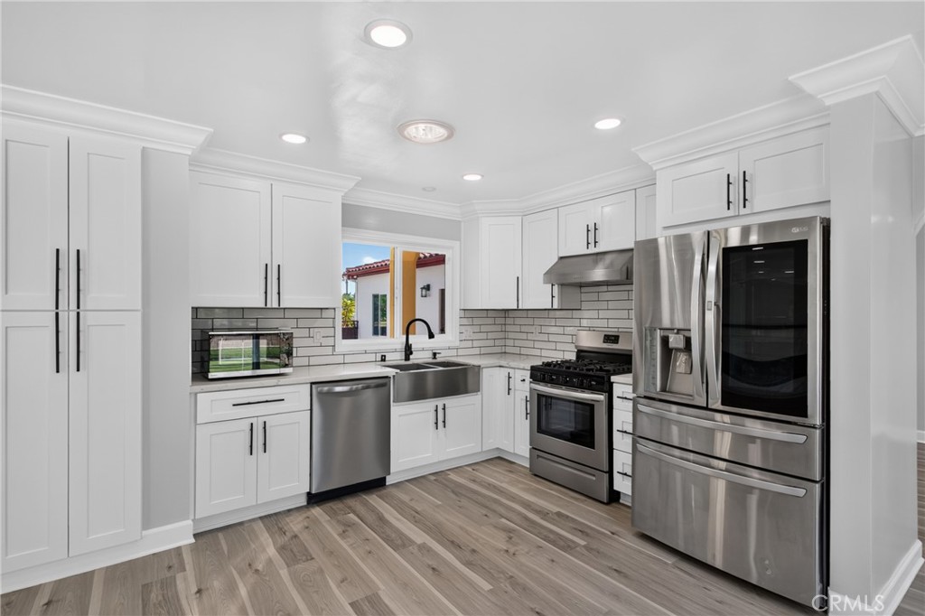Remodeled kitchen with newer appliances - 5451 Lockhaven Drive, Buena Park CA 90621 - photo 19