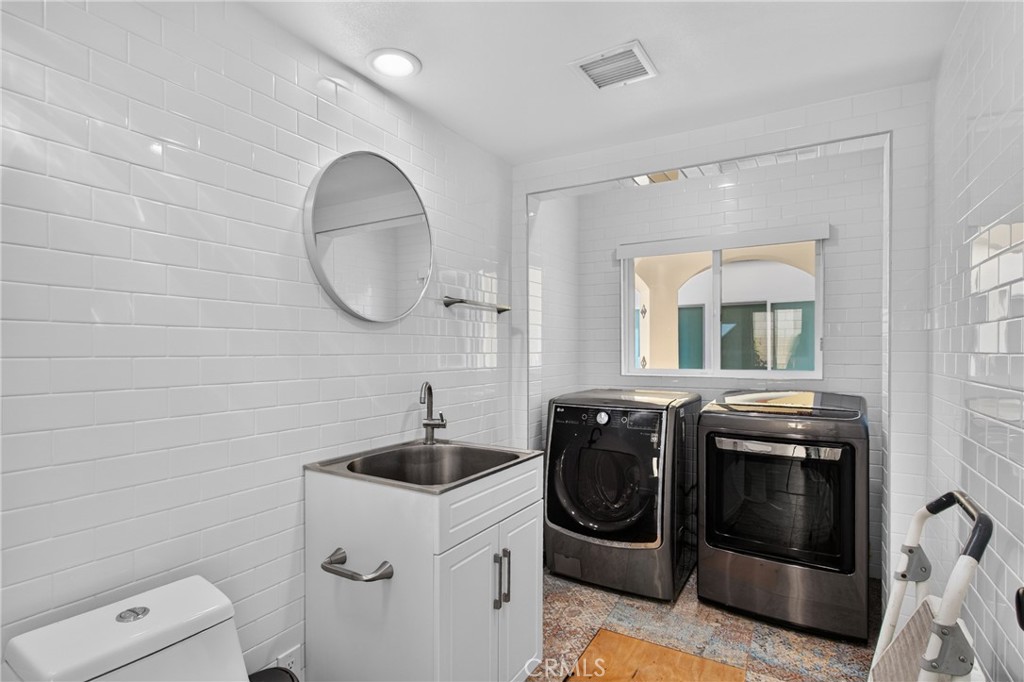Half bath and laundry room - 5451 Lockhaven Drive, Buena Park CA 90621 - photo 20