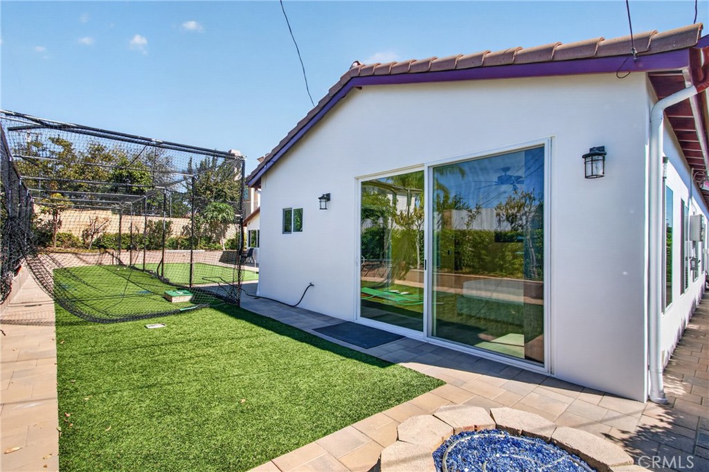 Back yard with artificial turf and fire pit - 5451 Lockhaven Drive, Buena Park CA 90621 - photo 30