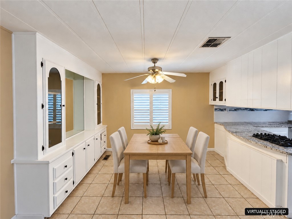 Virtually Staged Dining Area - 6741 Lincoln Avenue 146, Buena Park CA 90620 - photo 5