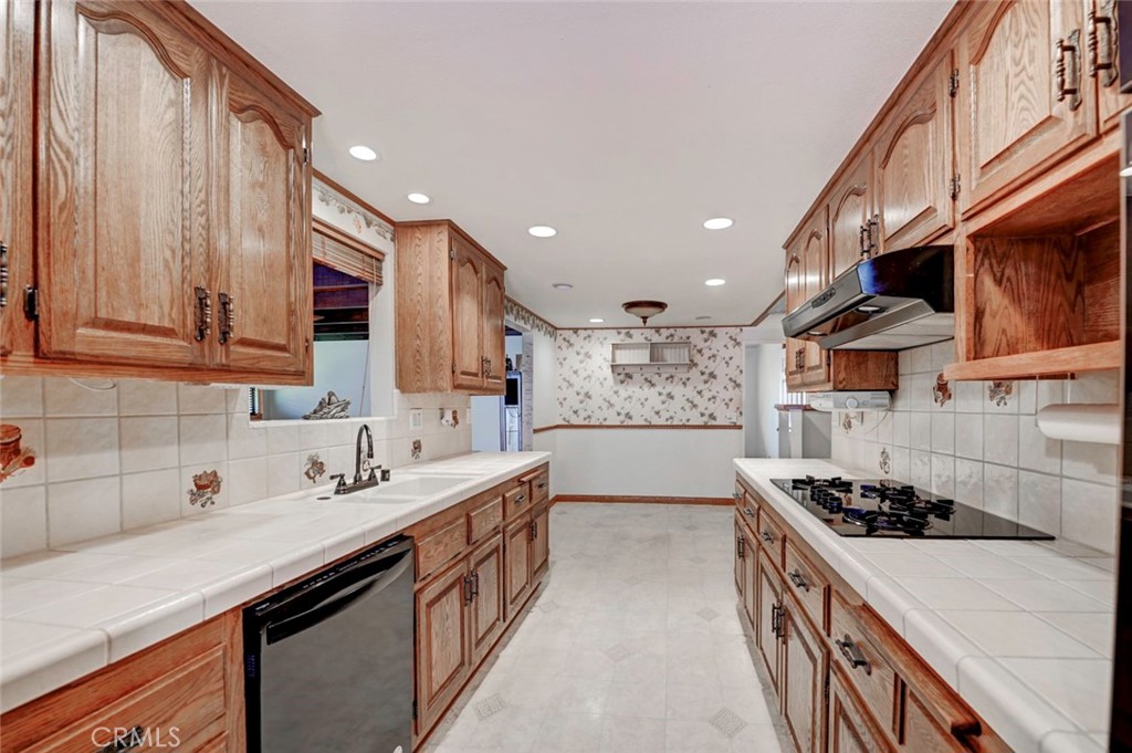 Kitchen with all black appliances - 7660 El Chaco, Buena Park CA 90620 - photo 8